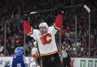 Calgary Flames' Milan Lucic celebrates his goal against Vancouver Canucks goalie Jacob Markstrom, left, of Sweden, during the third period of an NHL hockey game Saturday, Feb. 8, 2020, in Vancouver, British Columbia. (Darryl Dyck/The Canadian Press via AP)