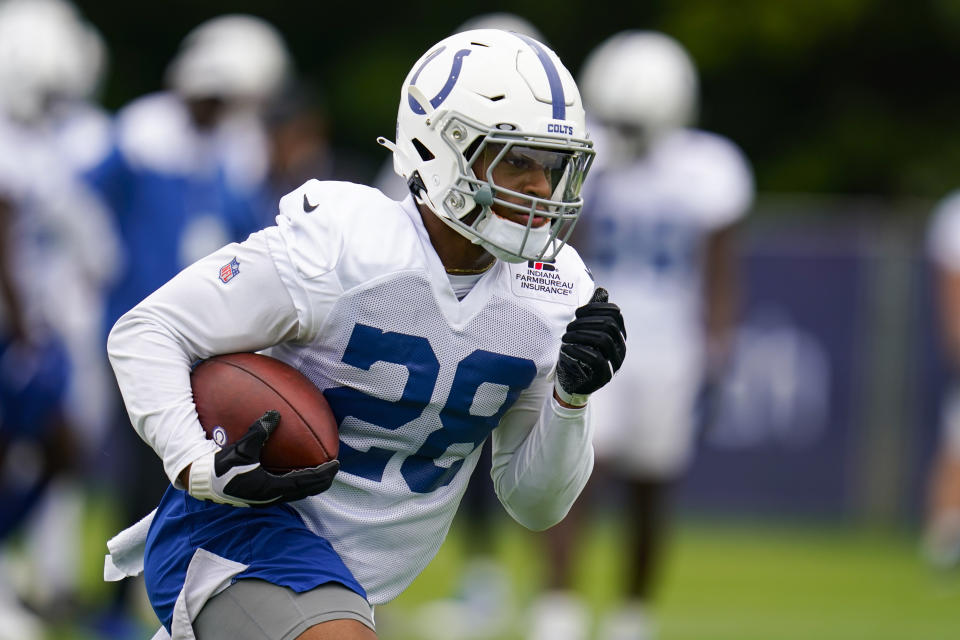 Indianapolis Colts running back Jonathan Taylor runs a drill during practice at the NFL team's football training camp in Westfield, Ind., Saturday, July 31, 2021. (AP Photo/Michael Conroy)