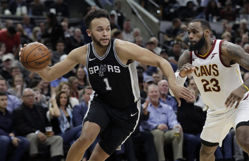 San Antonio Spurs forward Kyle Anderson drives around Cleveland Cavaliers forward LeBron James. (AP Photo/Eric Gay)