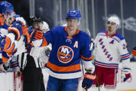 New York Islanders' Josh Bailey (12) celebrates with teammates after scoring a goal during the first period of an NHL hockey game against the New York Rangers on Tuesday, April 20, 2021, in Uniondale, N.Y. (AP Photo/Frank Franklin II)