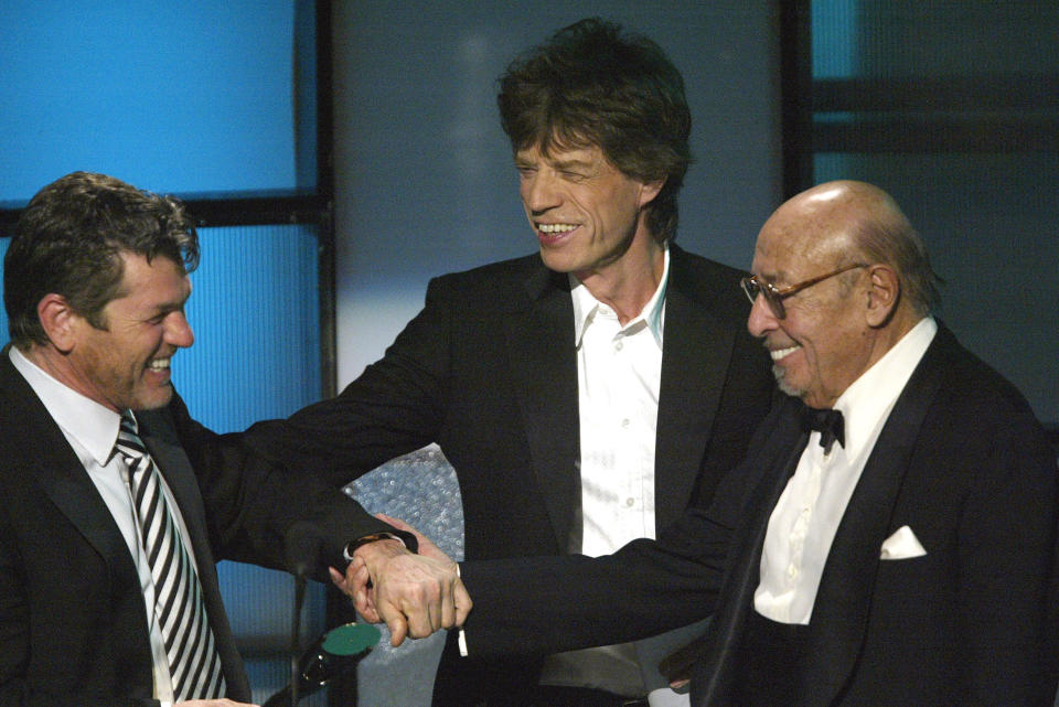 Musician Mick Jagger and Ahmet Ertegun induct Jann S. Wenner 