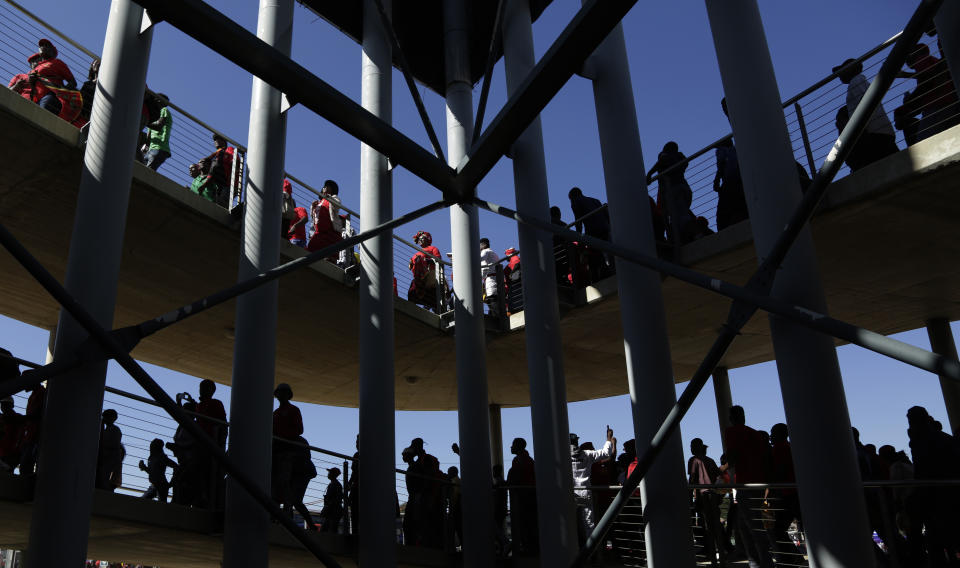 Supporters of the Economic Freedom Fighters (EFF) party arrive for their election rally at the Orlando Stadium in Soweto, South Africa, Sunday, May 5, 2019, ahead of South Africa's election on May 8. (AP Photo/Themba Hadebe)