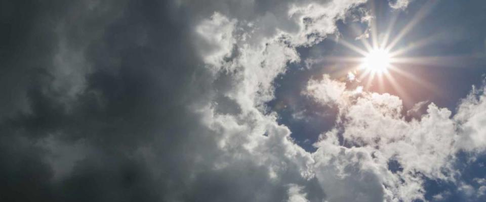 Rain Clouds in rainy season and the sun.