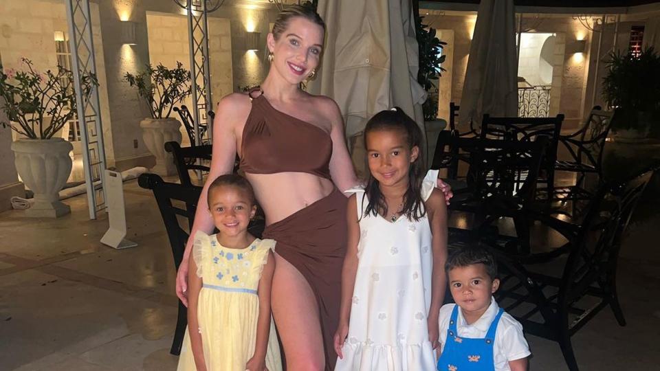 Helen Flanagan on holiday in brown dress with three children in tow