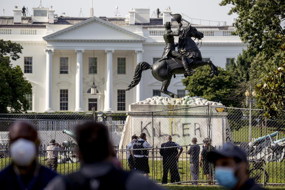 The White House is visible behind a statue of President Andrew Jackson in Lafayette Park, Tuesday, June 23, 2020, in Washington, with the word "Killer" spray painted on its base. Protesters tried to topple the statue Monday night. President Tump had tweeted late Monday that those who tried to topple the statue of President Andrew Jackson in Lafayette Park across the street from the White House faced 10 years in prison under the Veteran's Memorial Preservation Act. (AP Photo/Andrew Harnik)