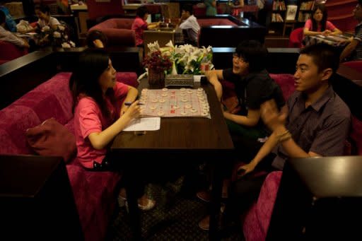 A couple is seen talking with a staff member at a singles club in Beijing. Pressure on China's women today is huge. Part of this is due to nation's one-child population control policy, which adds to the desperation of parents for their only offspring to marry and produce a grandson or granddaughter