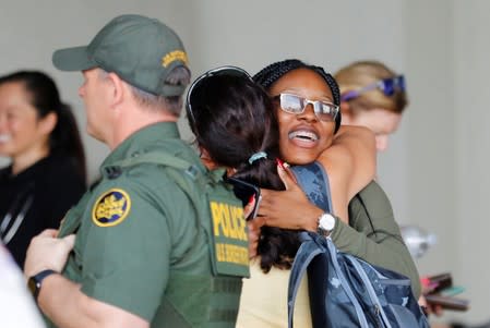 A passenger is greeted after disembarking the Bahamas Paradise Cruise Line ship, Grand Celebration, in Riviera Beach