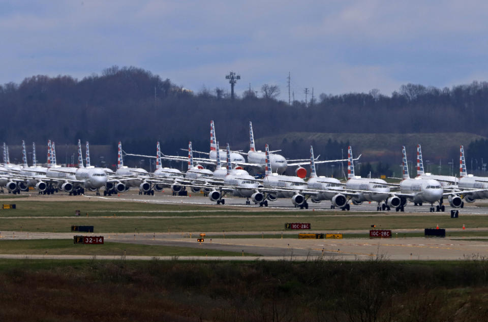 Some of the 88 American Airlines planes stored at Pittsburgh International Airport sit idle on a closed runway in Imperial, Pa., on Tuesday, March 31, 2020. As airlines cut more service, due to the COVID-19 pandemic, Pittsburgh International Airport has closed one of its four runways to shelter in place 96 planes, mostly from American Airlines, as of Monday, March 30, 2020. The airport has the capacity to store 140 planes.(AP Photo/Gene J. Puskar)