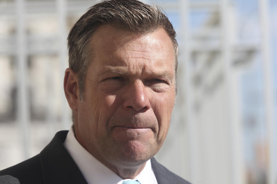 Kris Kobach, the Republican candidate for Kansas attorney general, ponders a question from reporters during a news conference, Thursday, Oct. 13, 2022, in Topeka, Kansas. (AP Photo/John Hanna)