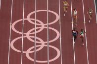 Habitam Alemu, of Ethiopia, and Athing Mu, of United States, head to the finish competes during the first round of the women's 800-meter at the 2020 Summer Olympics, Friday, July 30, 2021, in Tokyo. (AP Photo/Morry Gash)