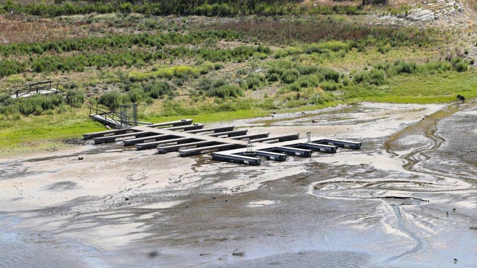 A dock at the upper reaches of the lake is about to be left high and dry as only a trickle of water flows into the lake due to drought. Many South San Luis Obispo county towns rely on Lopez Lake for most or all of their water; levels were at 28.4% on May 13, 2022.