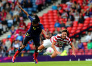 Abby Wambach (R) of USA clashes with Kelis Peduzine of Columbia during the Women's Football first round Group G match between United States and Colombia on Day 1 of the London 2012 Olympic Games at Hampden Park on July 28, 2012 in Glasgow, Scotland. (Photo by Stanley Chou/Getty Images)