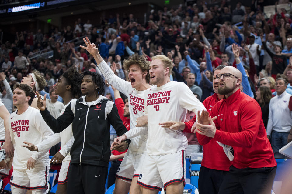 Dayton players and staff celebrates a three-pointer against Nevada during the second half of a first-round college basketball game in the NCAA Tournament in Salt Lake City, Thursday, March 21, 2024 (AP Photo/Isaac Hale)