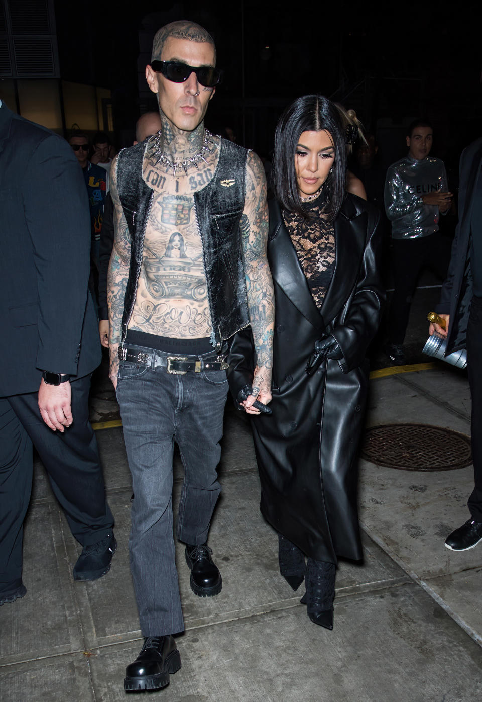 Travis Barker and Courtney hand in hand