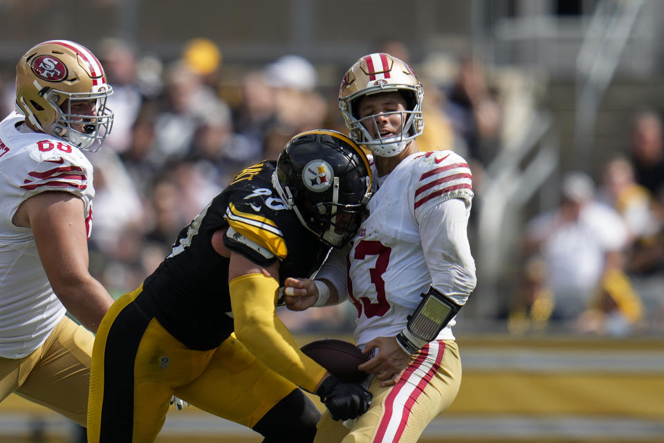 San Francisco 49ers quarterback Brock Purdy fumbles the ball while being sacked by Pittsburgh Steelers linebacker T.J. Watt during the second half of an NFL football game, Sunday, Sept. 10, 2023, in Pittsburgh. (AP Photo/Gene J. Puskar)