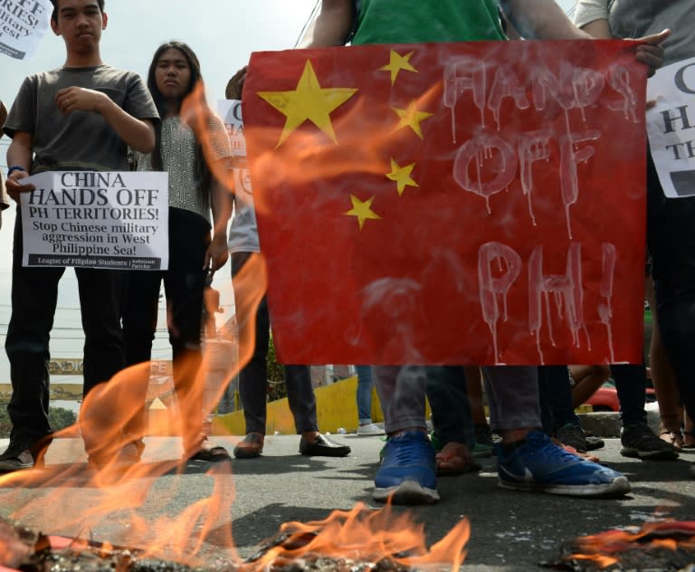 Filipino students at a rally in Manila on March 3, 2016, to denounce reports of Chinese vessels dropping anchor near a South China Sea atoll also claimed by the Philippines