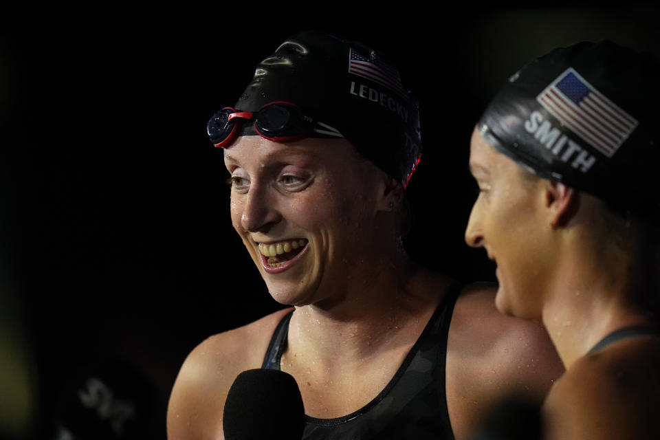 Katie Ledecky, left, of United States celebrates after finishing first in the women's 400m freestyle final at the 19th FINA World Championships in Budapest, Hungary, Saturday, June 18, 2022. (AP Photo/Petr David Josek)