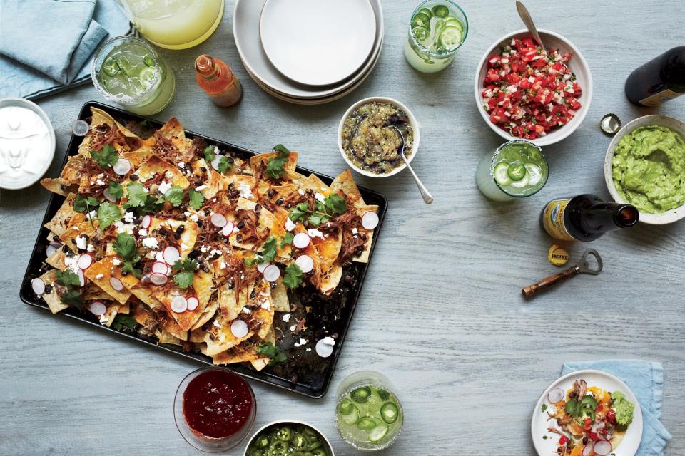 <h1 class="title">Nachos with All the Fixings</h1><cite class="credit">Photo by Christina Holmes</cite>