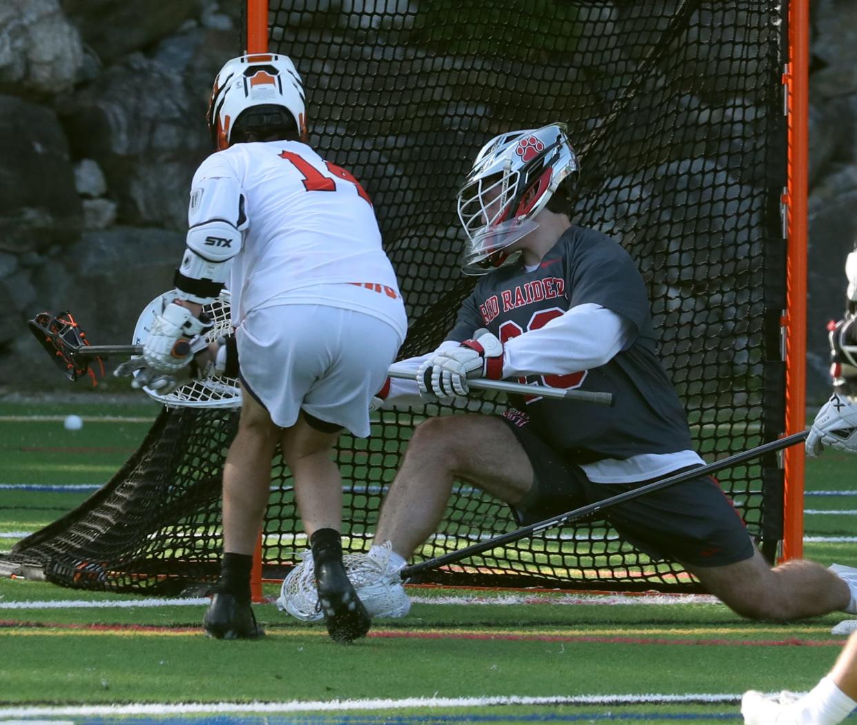 Mamaroneck's Grant Mathieson scores past North Rockland goalie Kevin Devine during their Section 1 Class A semifinal at Mamaroneck May 26, 2023. Mamaroneck won 12-7.