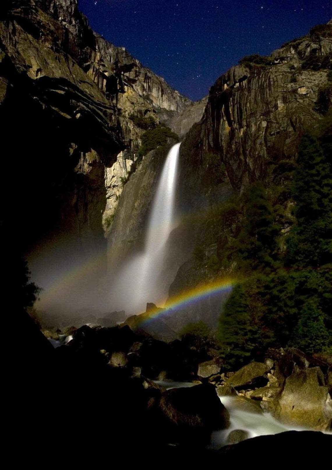 Springtime in Yosemite is a perfect time to observe a double lunar rainbow or “moonbow” created in the mist of lower Yosemite Fall while the full moon rises over the top of the granite walls of the Yosemite Valley. This photo was taken at 12: 25 a.m. allowing the moonlight to create the natural phenomena.