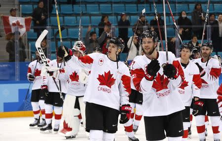 Ice Hockey - Pyeongchang 2018 Winter Olympics - Men's Bronze Medal Match - Czech Republic v Canada - Gangneung Hockey Centre, Gangneung, South Korea - February 24, 2018 - Canadian players acknowledge the crowd as they celebrate after their victory. REUTERS/Grigory Dukor