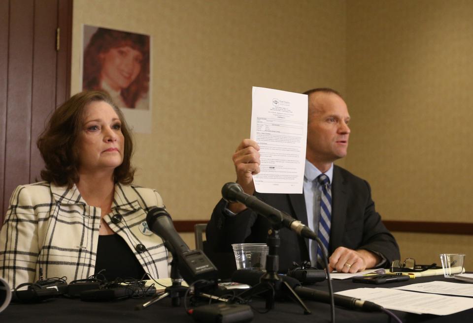 Attorney Craig Vernon holds up&nbsp;the results of his client McKenna Denson's lie detector test. Denson is suing the Church of Jesus Christ of Latter-day Saints for its handling of her rape allegations. (Photo: George Frey/Getty Images)