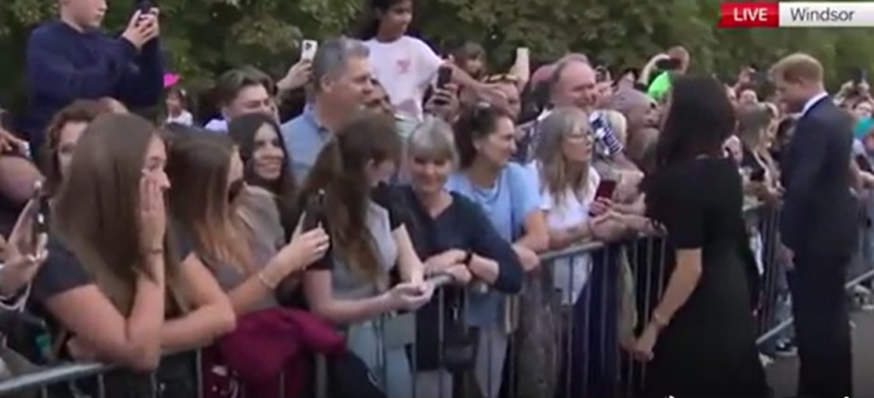 Footage shows one woman looking down as Meghan smiles at her (Independent TV)