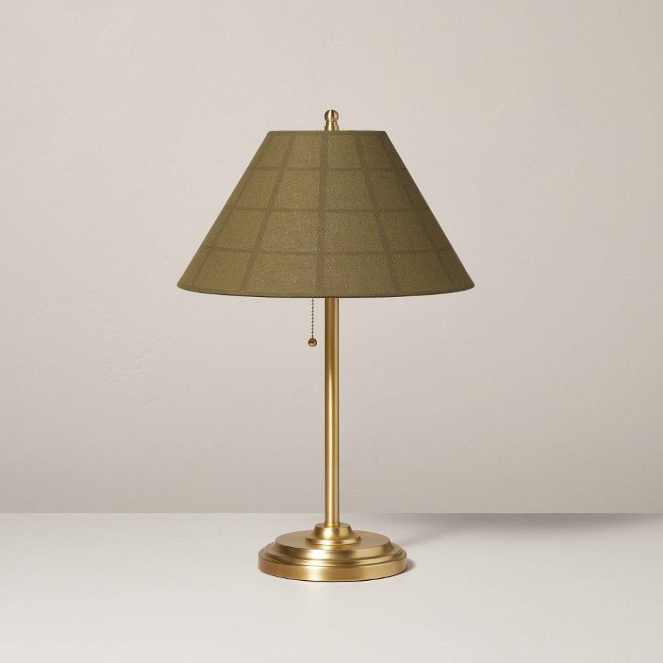 <p><a href="https://go.redirectingat.com?id=74968X1596630&url=https%3A%2F%2Fwww.target.com%2Fp%2F23-34-plaid-shade-metal-table-lamp-brass-green-hearth-38-hand-8482-with-magnolia%2F-%2FA-88503444&sref=https%3A%2F%2F" rel="nofollow noopener" target="_blank" data-ylk="slk:Shop Now;elm:context_link;itc:0;sec:content-canvas" class="link ">Shop Now</a></p><p>Plaid Shade Metal Table Lamp </p><p>target.com</p><p>$59.99</p>