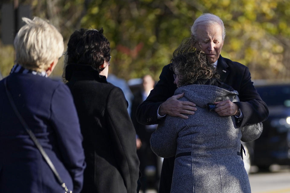 FILE - President Joe Biden hugs Kathy Lebel, co-owner of Schemengees Bar and Grille, one of the sites of last week's mass shooting, Friday, Nov. 3, 2023, in Lewiston, Maine. A special commission organized to investigate the response to the Lewiston, Maine, mass shooting last year is set to hear testimony from more police on Thursday, Feb. 8, 2024. (AP Photo/Evan Vucci, File)