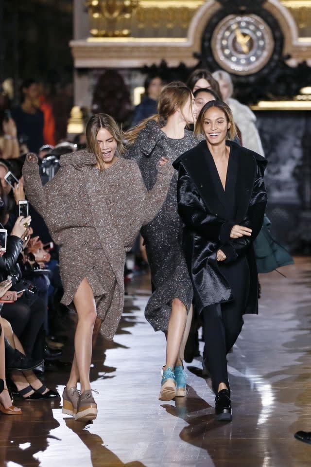 Cara Delevingne and Joan Smalls dance as they present creations by Stella McCartney