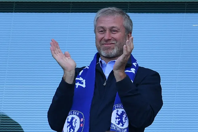 Chelsea's Russian owner Roman Abramovich applauds, as players celebrate their league title win at the end of the Premier League football match between Chelsea and Sunderland at Stamford Bridge in London on May 21, 2017.
Chelsea's extended victory parade reached a climax with the trophy presentation on May 21, 2017 after being crowned Premier League champions with two games to go.  / AFP PHOTO / Ben STANSALL / RESTRICTED TO EDITORIAL USE. No use with unauthorized audio, video, data, fixture lists, club/league logos or 'live' services. Online in-match use limited to 75 images, no video emulation. No use in betting, games or single club/league/player publications.  /         (Photo credit should read BEN STANSALL/AFP via Getty Images)