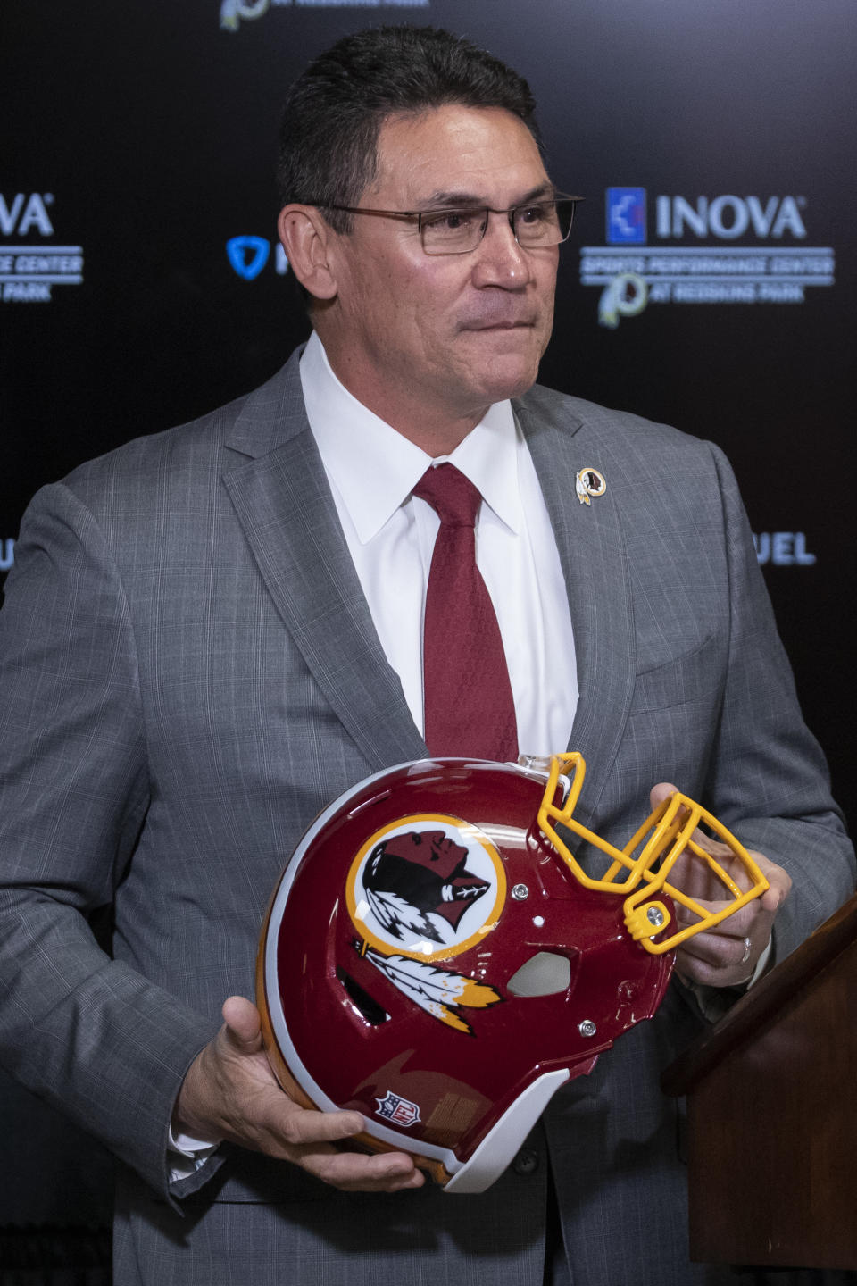 Washington Redskins new head coach Ron Rivera holds up a helmet during a news conference at the team's NFL football training facility, Thursday, Jan. 2, 2020 in Ashburn, Va. (AP Photo/Alex Brandon)