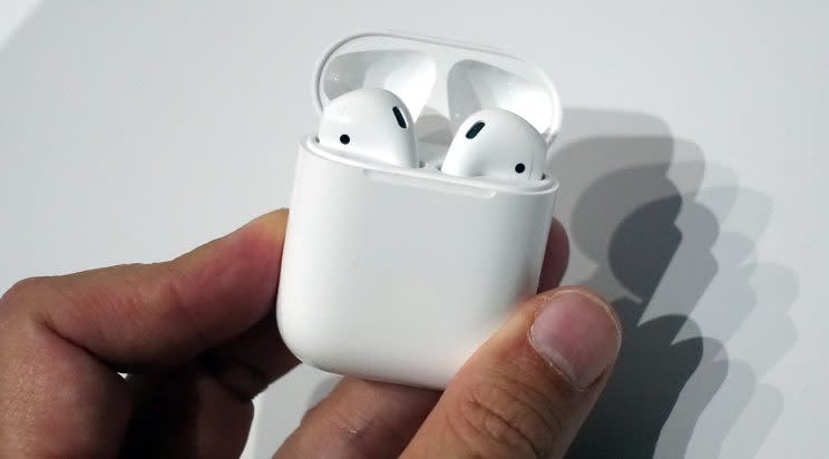 The AirPods all nestled in their charging case.