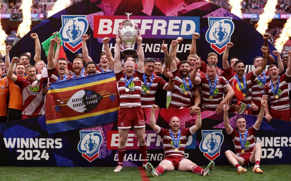 Liam Farrell lifts the trophy with team-mates