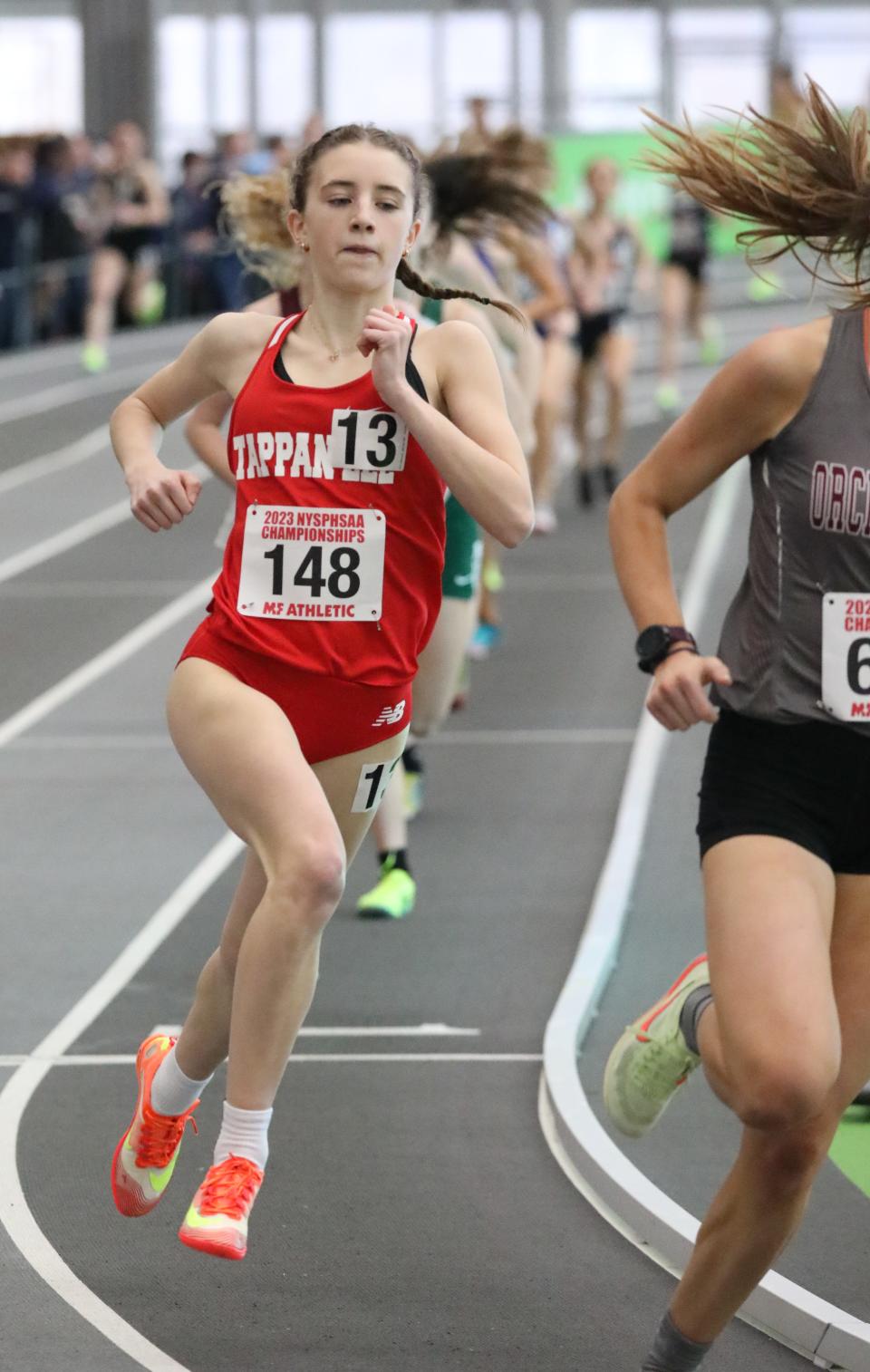 Bridget Dunn from Tappan Zee competes in the girls 1000 meter run during the New York State Indoor Track and Field Championships, at the Ocean Breeze Athletic Complex on Staten Island, March 4, 2023. 