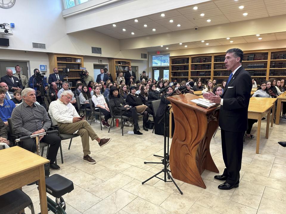 Rep. David Kustoff, R-Tenn., right, speaks with people at Margolin Hebrew Academy-Feinstone Yeshiva of the South on Monday, Oct. 30, 2023, in Memphis, Tenn. Kustoff and Tennessee Gov. Bill Lee are praising security measures at the school where an ex-student with a gun was stopped from entering the building in July. (AP Photo/Adrian Sainz).