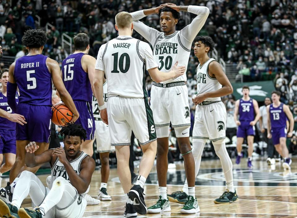 Michigan State's Marcus Bingham Jr., center, and the team reacts after losing to Northwestern on Saturday, Jan. 15, 2022, at the Breslin Center in East Lansing.