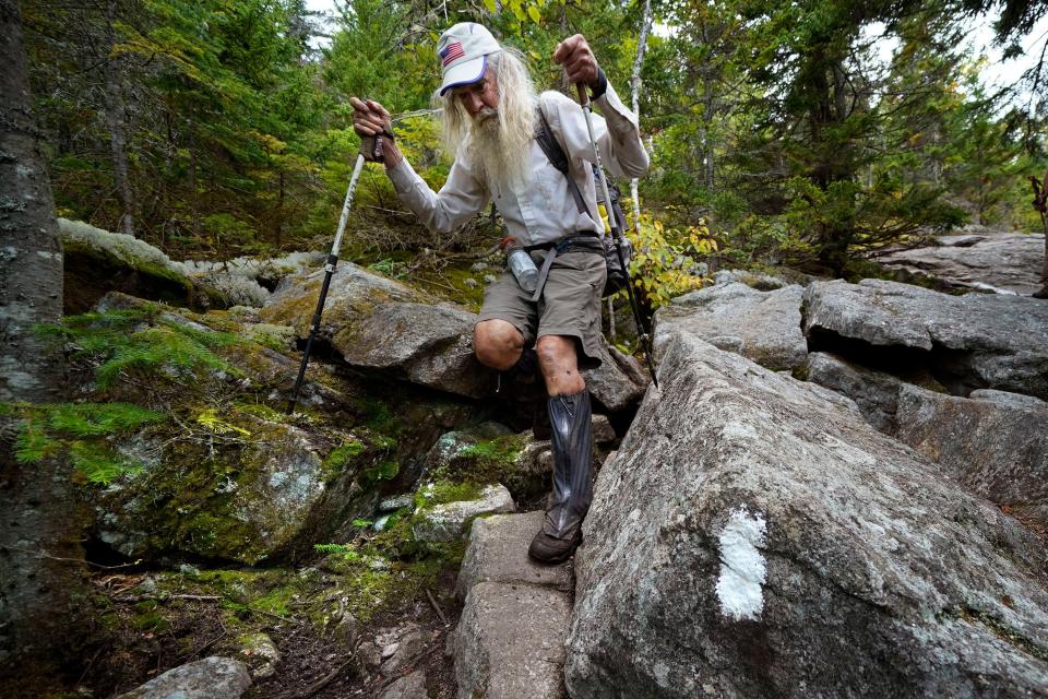 M.J. Eberhart, 83, makes his way through large rocks while descending Mount Hayes on the Appalachian Trail on Sept. 12.