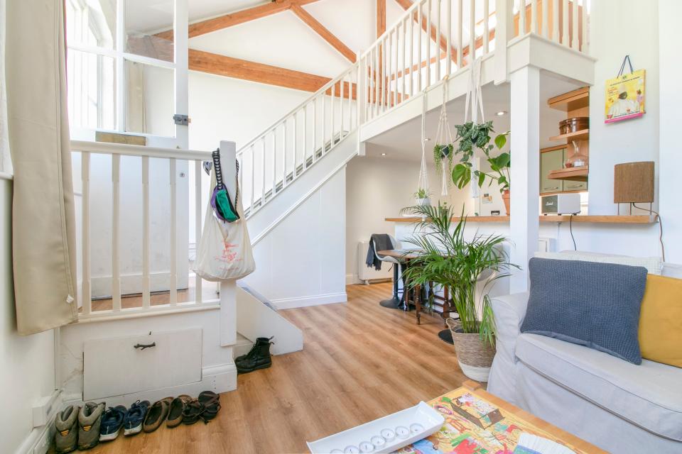 The cottage has a mezzanine bedroom over the open-plan living space and kitchen (Stirling Ackroyd)