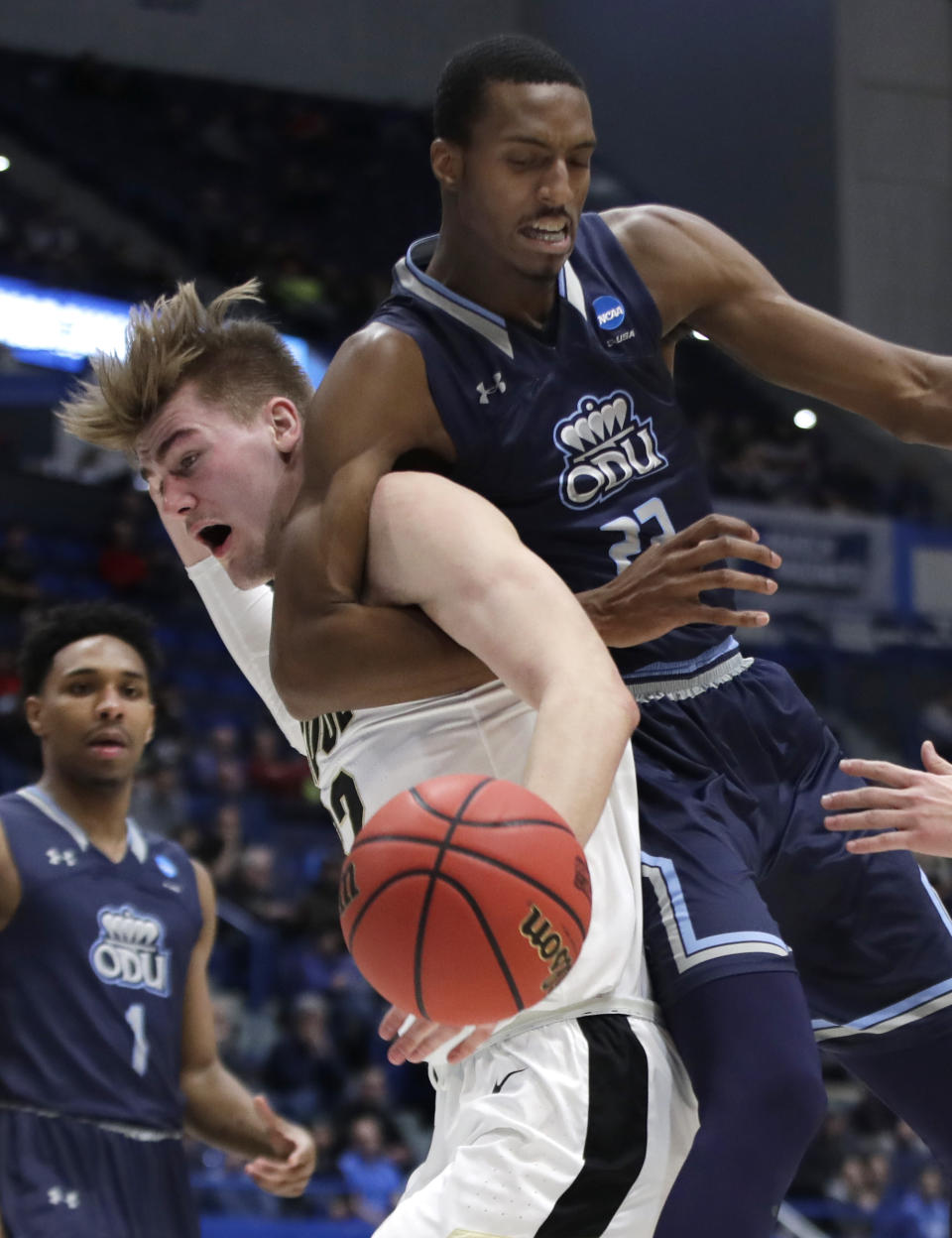 <p>Old Dominion’s Dajour Dickens (23) and Purdue’s Matt Haarms compete for a rebound during the second half of a first-round game in the NCAA men’s college basketball tournament Thursday, March 21, 2019, in Hartford, Conn. Purdue won 61-48. (AP Photo/Elise Amendola) </p>