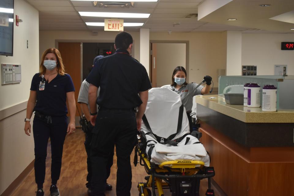 A nurse and REACT paramedics in the SSM Health St. Anthony Hospital-Shawnee Emergency Room.