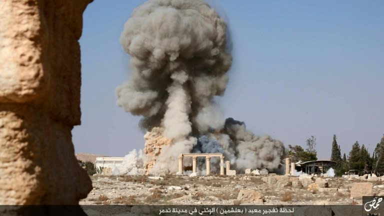 An Islamic State group video screenshot from August 25, 2015, allegedly shows smoke billowing from the Baal Shamin temple in Syria's ancient city of Palmyra