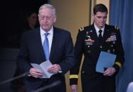 US Secretary of Defense James Mattis (L) and Central Command Commander Joseph Votel arrive for a briefing at the Pentagon in Washington, DC, on April 11, 2017