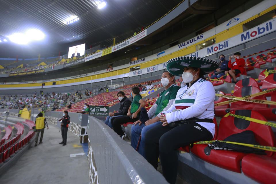 GUADALAJARA, MEXICO - MARCH 24: Fans of Mexico sit on the stands prior to the match between Mexico and USA as part of the 2020 Concacaf Men's Olympic Qualifying at Jalisco Stadium on March 24, 2021 in Guadalajara, Mexico. (Photo by Cesar Gomez/Jam Media/Getty Images)