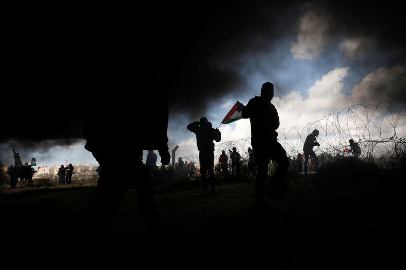 Palestinian demonstrators take part in a protest against U.S. President Donald Trump's Middle East peace plan, in the village of Bilin in the Israeli-occupied West Bank