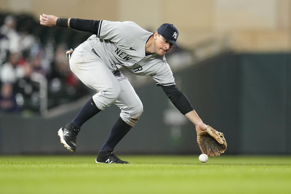 New York Yankees third baseman DJ LeMahieu fields an infield single by Minnesota Twins' Michael A. Taylor during the sixth inning of a baseball game Monday, April 24, 2023, in Minneapolis. (AP Photo/Abbie Parr)