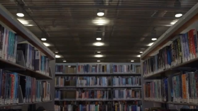 The inside of a library with books on the shelf