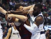 Mar 16, 2019; Dallas, TX, USA; Dallas Mavericks guard Tim Hardaway Jr. (11) and Cleveland Cavaliers center Ante Zizic (41) go for a loose ball during the first half at American Airlines Center. Mandatory Credit: Kevin Jairaj-USA TODAY Sports