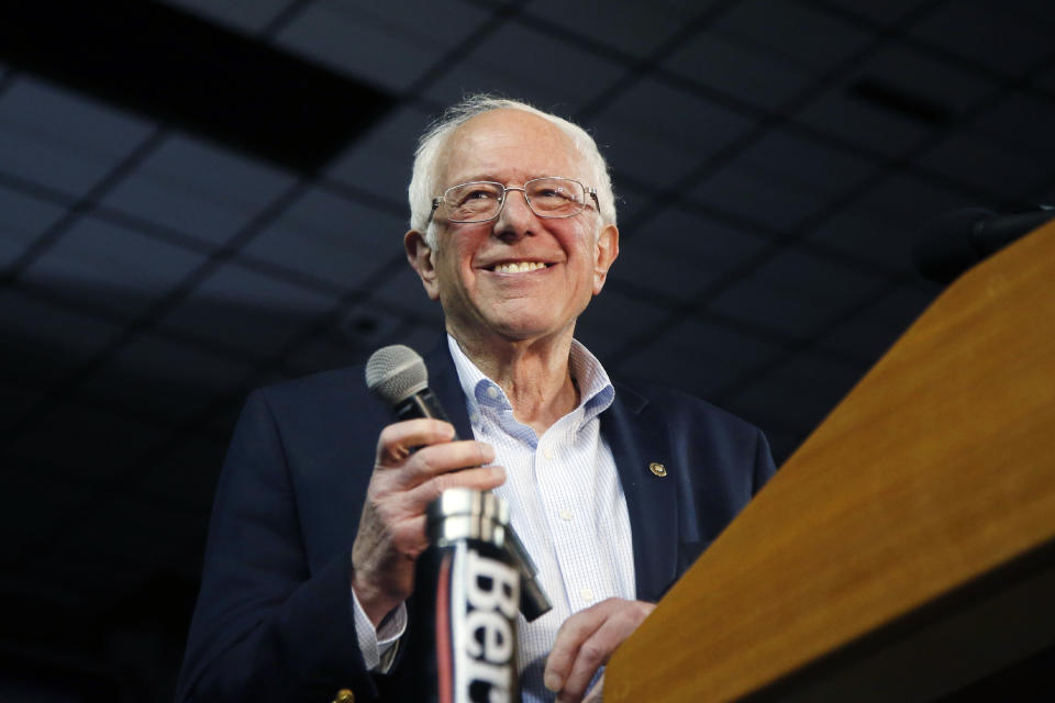 Democratic presidential candidate Sen. Bernie Sanders, I-Vt., smiles as he walks on stage to applause at a campaign rally Thursday, March 5, 2020, in Phoenix. (AP Photo/Ross D. Franklin)