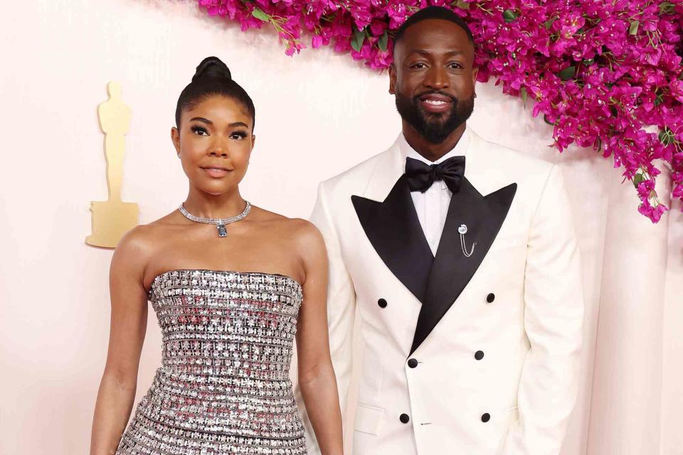 <p>Kevin Mazur/Getty</p> Gabrielle Union-Wade and Dwyane Wade attend the 96th Annual Academy Awards in March 2024